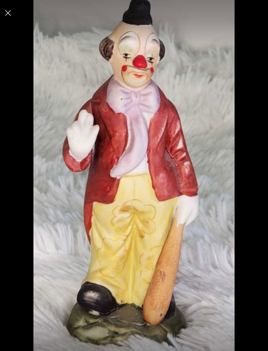 Clown statue with a baseball bat image 0