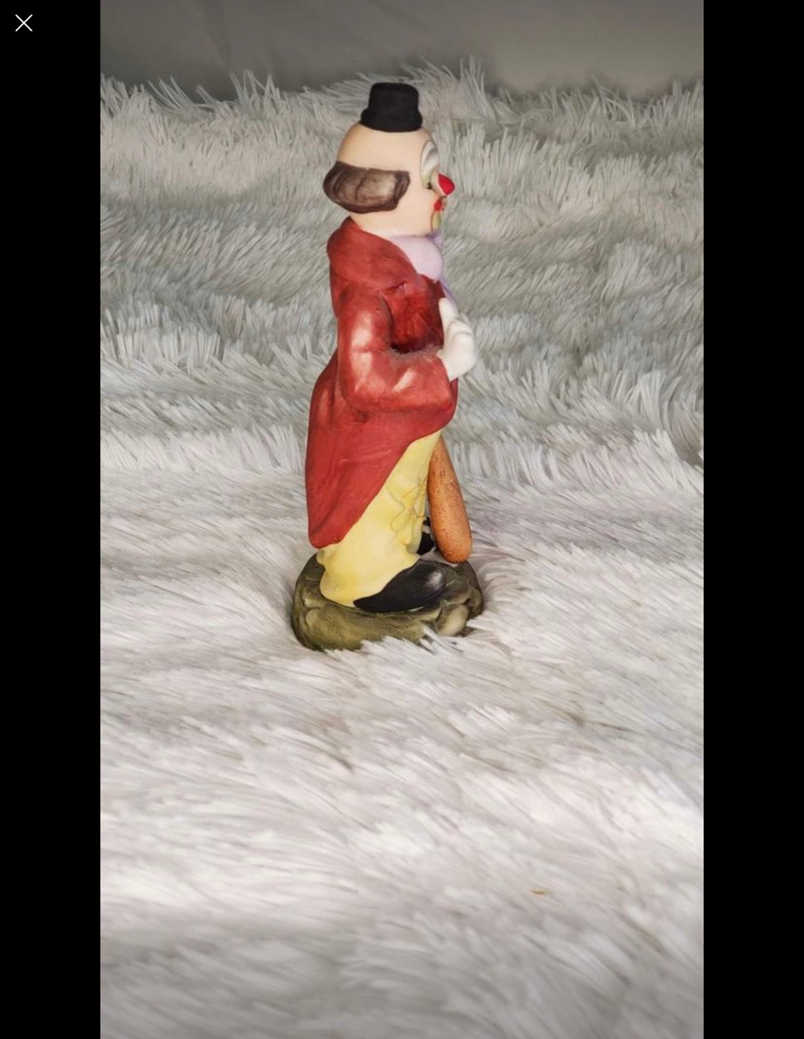 Clown statue with a baseball bat image 4