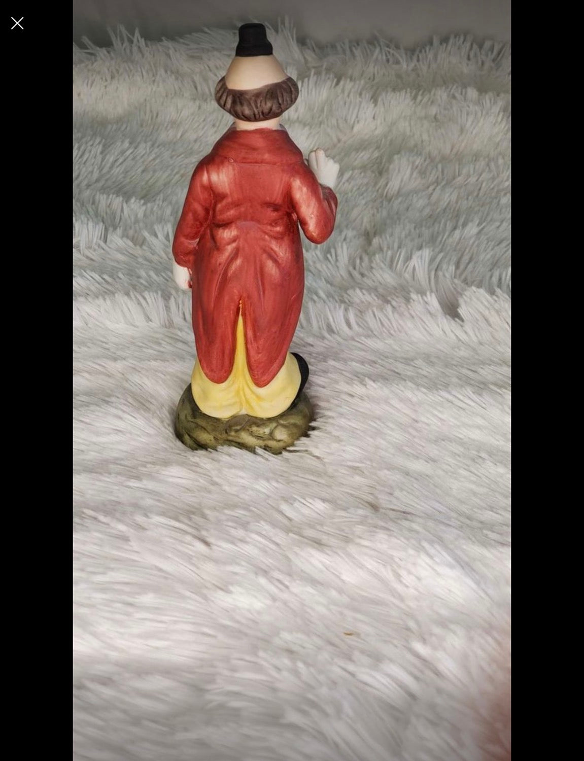 Clown statue with a baseball bat image 2