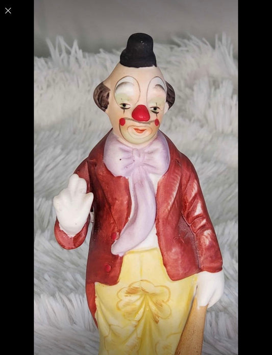 Clown statue with a baseball bat image 1