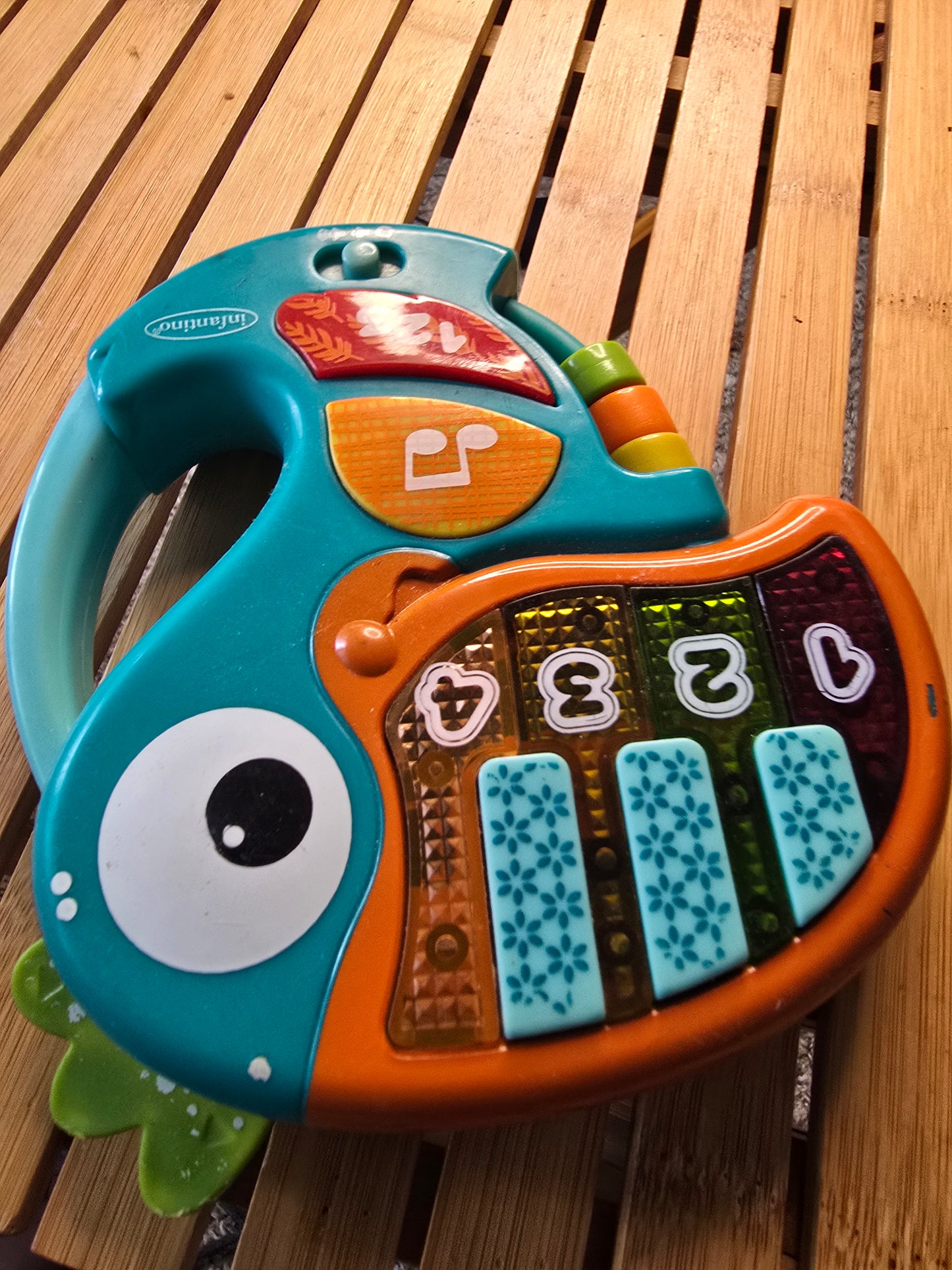 Infantino Musical Fish Baby Activity Toy – Lights, Sounds & Piano Keys – Teal Orange