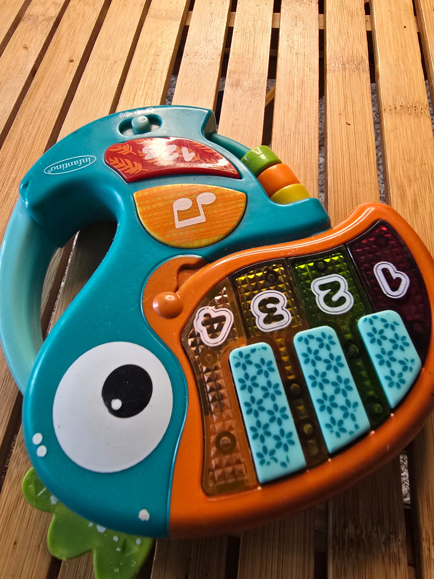 Infantino Musical Fish Baby Activity Toy – Lights, Sounds & Piano Keys – Teal Orange