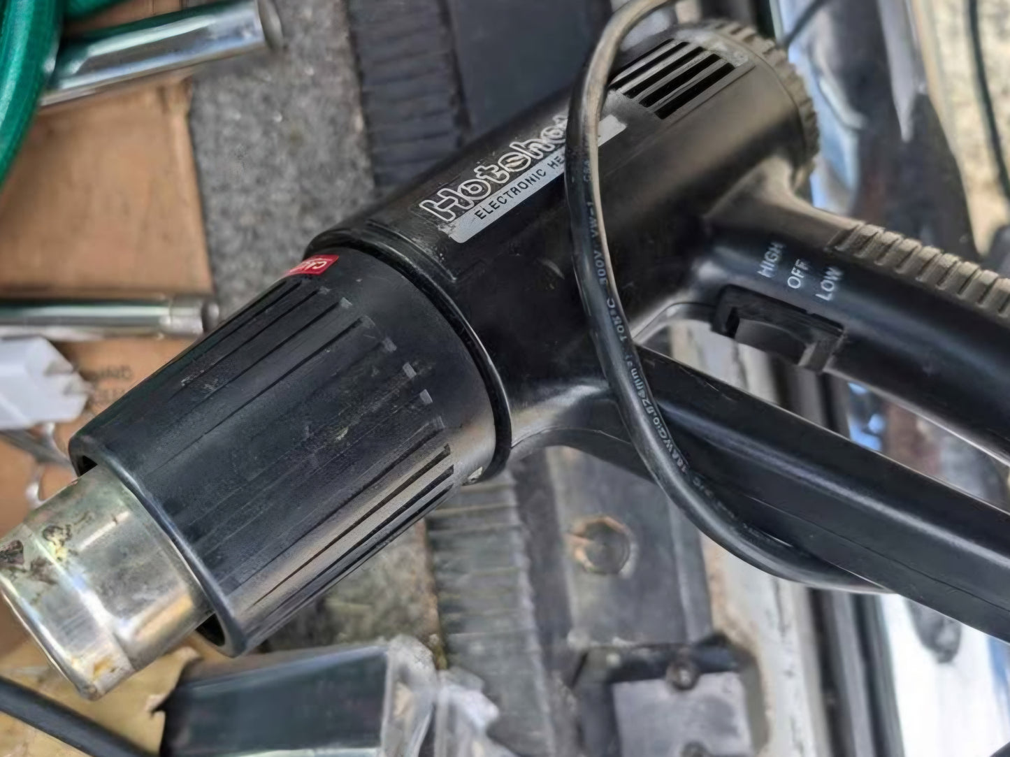 commercial impulse heat sealer includes a heat gun for versatile bag sealing applications